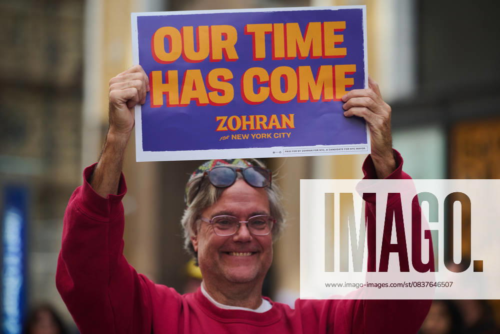 Protester holds up a sign that reads, â€oeOur Time Has Come…Zohran for New York City†in the New York City No Kings protest in opposition to measures Donald Trump has taken to install authoritarian style rule. New York USA - ZUMAl171 20251018_znp_l171_032