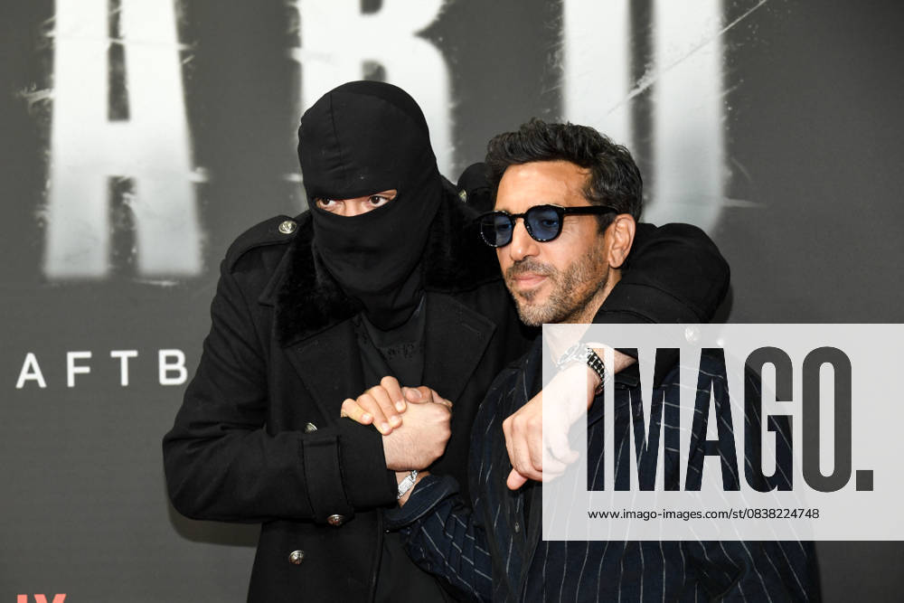 Abb Haftbefehl Aykut Anhan with balaclava and Elyas M Barek as guests on the red carpet of the special screening event of the Netflix documentary highlight Babo The Haftbefehl Story at the Astor Film Lounge on 24 10 2025in Berlin Berlin Germany
