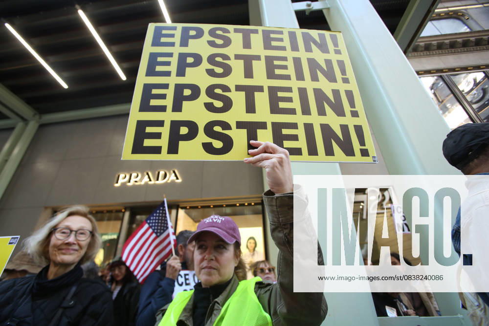 A woman holds a sign that says Epstein during a Hands Off NYC rally. outside of Trump Tower on October 25, 2025. Some women wore polka dots in honor of a protestor who confronted ICE agents and tank vehicles. The peaceful rally drew a handful of Trump supporters. New York City USA - ZUMAk45_ 20251025_zaf_k45_011