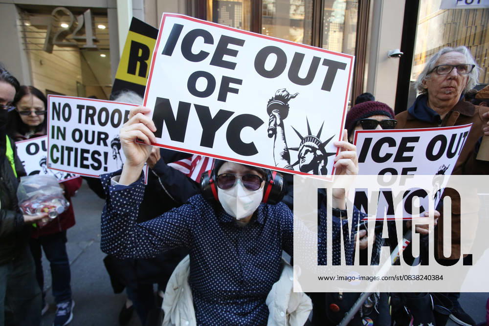 A woman holds a sign that says ICE Out of NYC during a Hands Off NYC rally outside of Trump Tower on October 25, 2025. Some women wore polka dots in honor of a protestor who confronted ICE agents and tank vehicles. The peaceful rally drew a handful of Trump supporters. New York City USA - ZUMAk45_ 20251025_zaf_k45_015