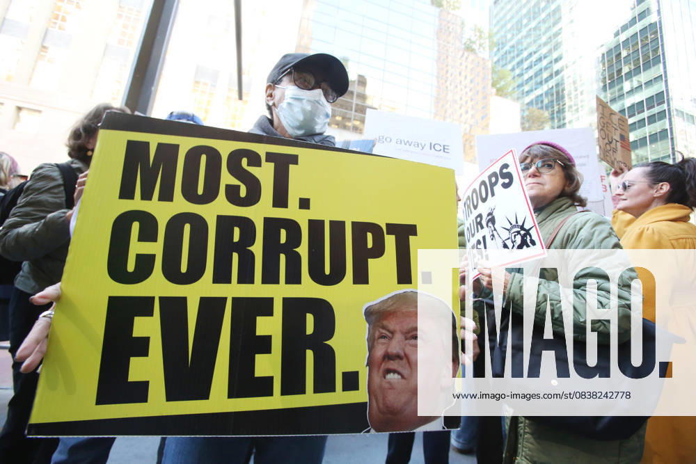 A woman holds a sign that says Most Corrupt Ever during a Hands Off NYC rally outside of Trump Tower on October 25, 2025. Some women wore polka dots in honor of a protestor who confronted ICE agents and tank vehicles. The peaceful rally drew a handful of Trump supporters. New York City USA - ZUMAk45_ 20251025_zaf_k45_022