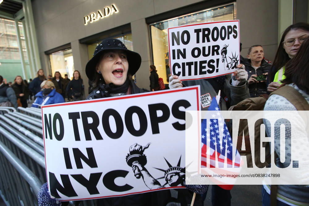 A woman holds a sign during a Hands Off NYC rally outside of Trump Tower on October 25, 2025. Some women wore polka dots in honor of a protestor who confronted ICE agents and tank vehicles. The peaceful rally drew a handful of Trump supporters. New York City USA - ZUMAk45_ 20251025_zaf_k45_038