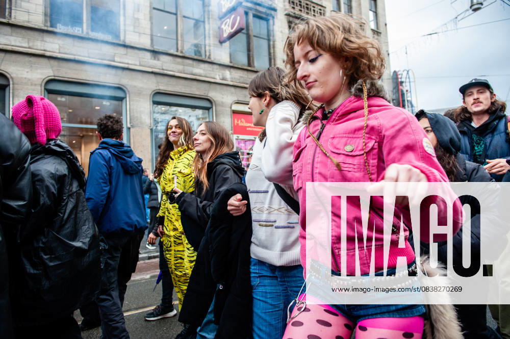 A woman in pink clothes is enjoying the music. ADEV (Amsterdam Danst Ergens Voor), in English Amsterdam Dances For A Cause , organized for the 13th time its annual demonstration for squatting, free spaces, and affordable housing in the city. People danced, accompanied by large trucks and loud music systems, to reclaim more free spaces in the city. Amsterdam Netherlands - ZUMAs197 20251025_aaa_s197_449
