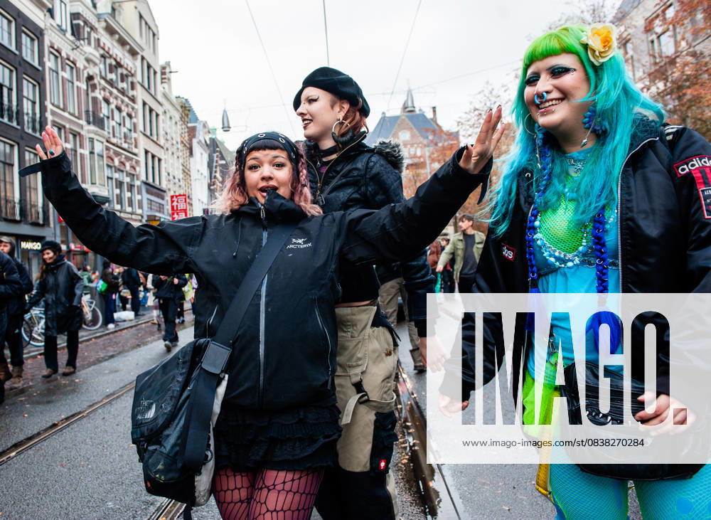 A group of women is posing for the media while dancing. ADEV (Amsterdam Danst Ergens Voor), in English Amsterdam Dances For A Cause , organized for the 13th time its annual demonstration for squatting, free spaces, and affordable housing in the city. People danced, accompanied by large trucks and loud music systems, to reclaim more free spaces in the city. Amsterdam Netherlands - ZUMAs197 20251025_aaa_s197_459