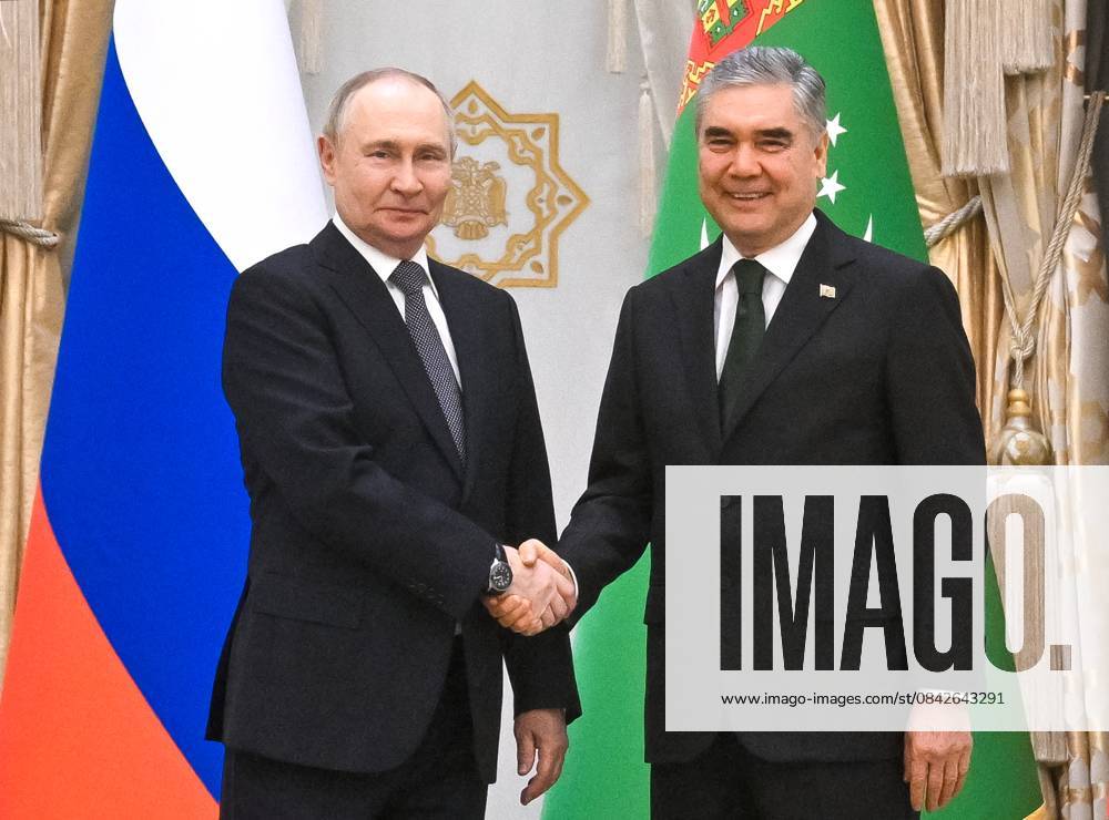 Turkmenistan Russia 9069804 12.12.2025 Russian President Vladimir Putin and Chairman of the People s Council of Turkmenistan (Khalk Maslahaty) Gurbanguly Berdimuhamedov shake hands as they pose for photos before a meeting in Ashgabat, Turkmenistan. Kristina Kormilitsyna Sputnik Ashgabad Turkmenistan