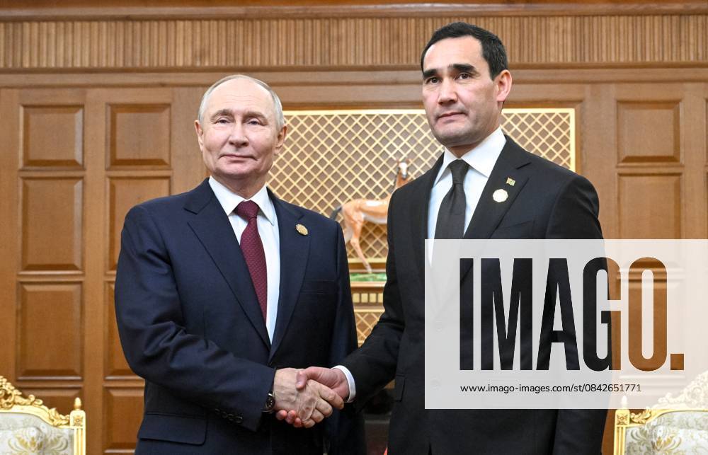 Turkmenistan Russia 9069939 12.12.2025 Russian President Vladimir Putin and Turkmen President Serdar Berdimuhamedov shake hands as they pose for photos before a meeting in Ashgabat, Turkmenistan. Kristina Kormilitsyna Sputnik Ashgabat Turkmenistan