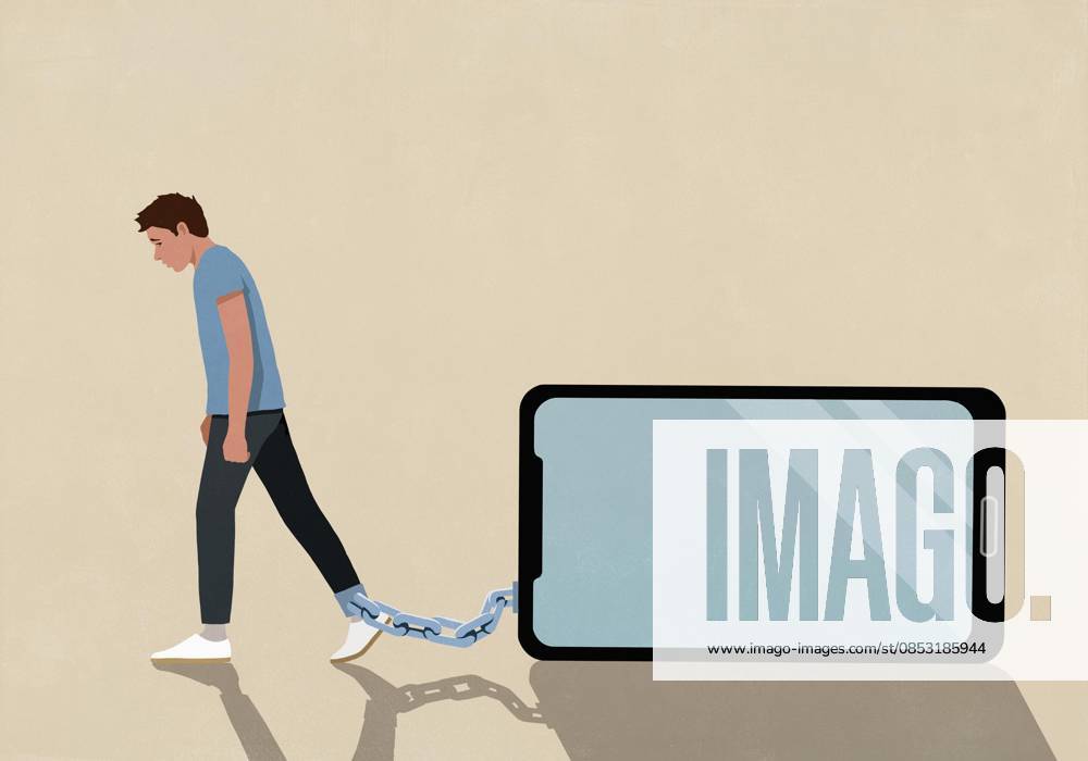 Man dragging large smart phone chained to his ankle on beige background