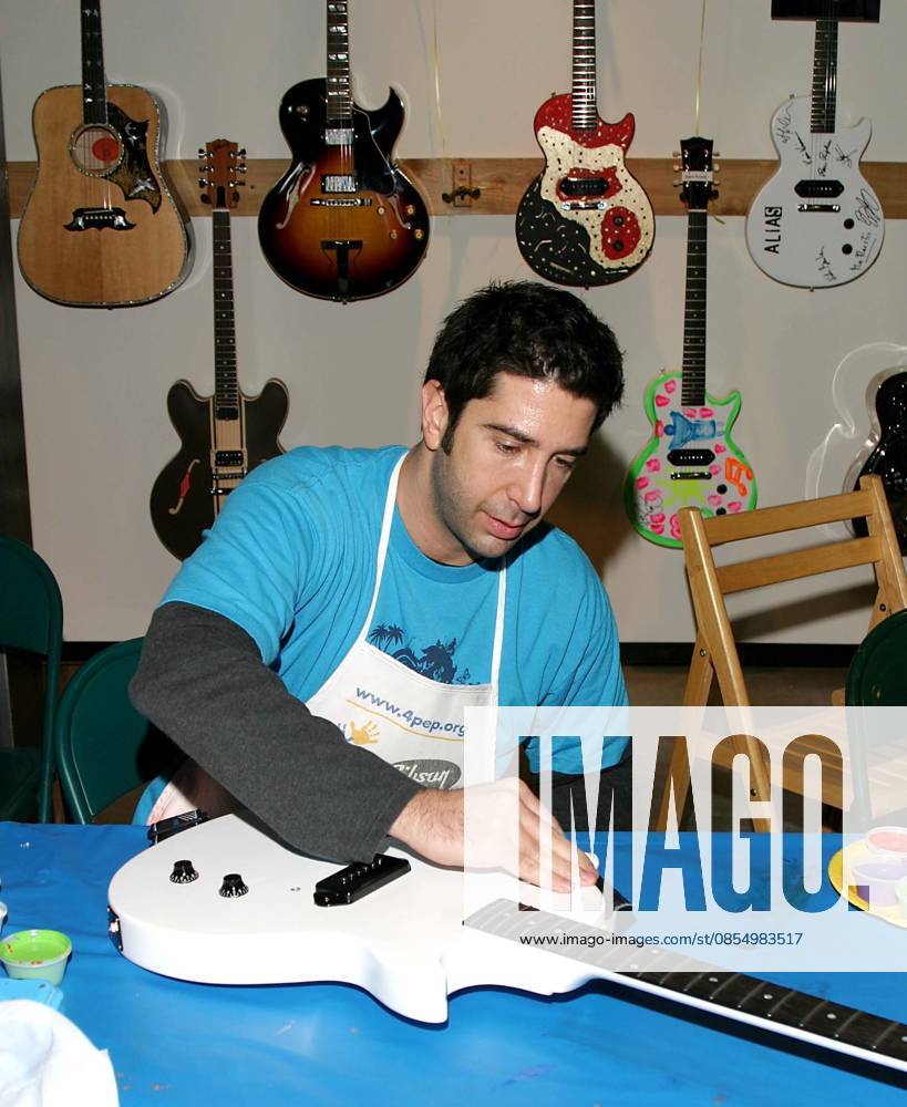 GIBSON GUITA JR Dec. 4, 2004 - Beverly Hills, CALIFORNIA, USA - K40723JR.GIBSON GUITAR PAINT FOR PEP CHARITY EVENT..AT THE GIBSON BALDWIN SHOWROOM BEVERLY HILLS, CA..12-04-2004. JAIMIE RODRIGUEZ 2004.DAVID SCHWIMMER