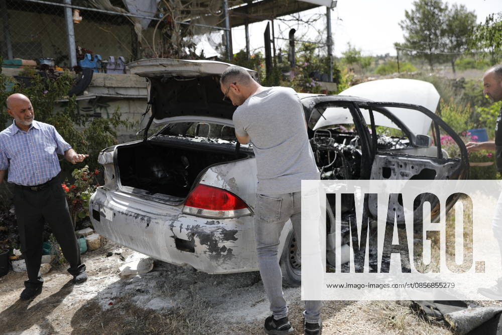 Palestinians inspect damage after settler attack near Hebron Palestinians inspect damage at the site of an attack carried out by Israeli settlers targeting Palestinian vehicles and property in the town of Surif northwest of Hebron in the occupied West Bank on May 17, 2026. Settlers set fire to a vehicle and spray-painted racist slogans at the scene, amid anger and condemnation among Palestinian residents over repeated attacks on their property. Photo by Mamoun Wazwaz apaimages Hebron West Bank Palestinian Territory 170526_Hebron_MW_00(10)