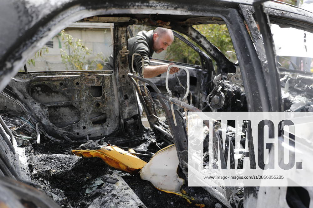 Palestinians inspect damage after settler attack near Hebron Palestinians inspect damage at the site of an attack carried out by Israeli settlers targeting Palestinian vehicles and property in the town of Surif northwest of Hebron in the occupied West Bank on May 17, 2026. Settlers set fire to a vehicle and spray-painted racist slogans at the scene, amid anger and condemnation among Palestinian residents over repeated attacks on their property. Photo by Mamoun Wazwaz apaimages Hebron West Bank Palestinian Territory 170526_Hebron_MW_00(30)