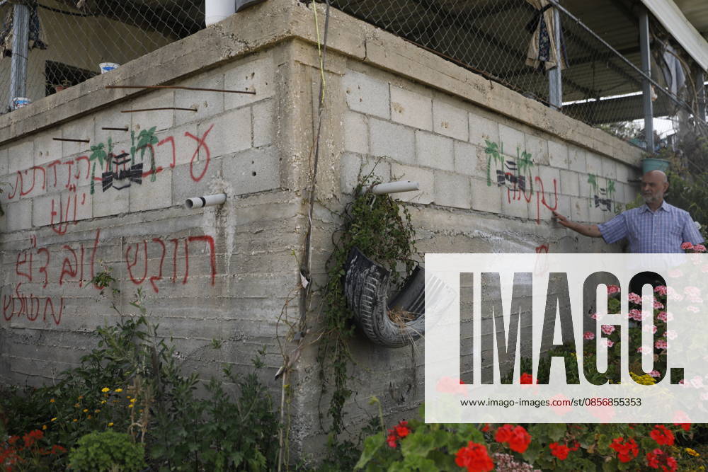 Palestinians inspect damage after settler attack near Hebron Palestinians inspect damage at the site of an attack carried out by Israeli settlers targeting Palestinian vehicles and property in the town of Surif northwest of Hebron in the occupied West Bank on May 17, 2026. Settlers set fire to a vehicle and spray-painted racist slogans at the scene, amid anger and condemnation among Palestinian residents over repeated attacks on their property. Photo by Mamoun Wazwaz apaimages Hebron West Bank Palestinian Territory 170526_Hebron_MW_00(25)