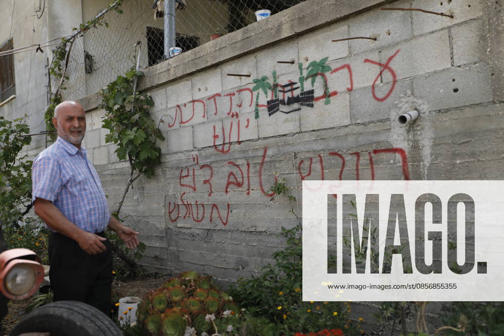 Palestinians inspect damage after settler attack near Hebron Palestinians inspect damage at the site of an attack carried out by Israeli settlers targeting Palestinian vehicles and property in the town of Surif northwest of Hebron in the occupied West Bank on May 17, 2026. Settlers set fire to a vehicle and spray-painted racist slogans at the scene, amid anger and condemnation among Palestinian residents over repeated attacks on their property. Photo by Mamoun Wazwaz apaimages Hebron West Bank Palestinian Territory 170526_Hebron_MW_00(26)