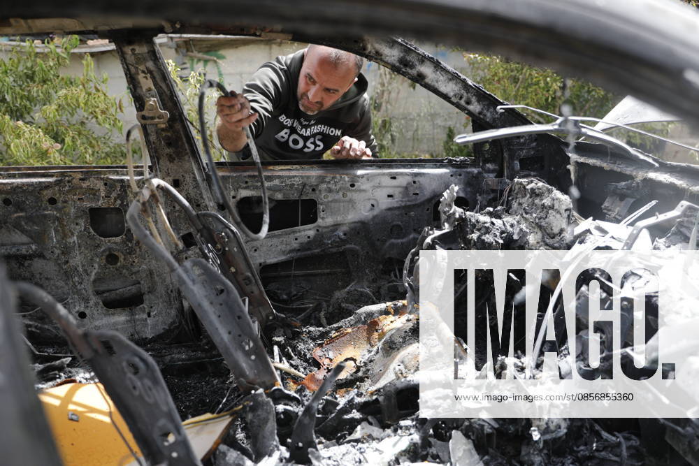 Palestinians inspect damage after settler attack near Hebron Palestinians inspect damage at the site of an attack carried out by Israeli settlers targeting Palestinian vehicles and property in the town of Surif northwest of Hebron in the occupied West Bank on May 17, 2026. Settlers set fire to a vehicle and spray-painted racist slogans at the scene, amid anger and condemnation among Palestinian residents over repeated attacks on their property. Photo by Mamoun Wazwaz apaimages Hebron West Bank Palestinian Territory 170526_Hebron_MW_00(28)