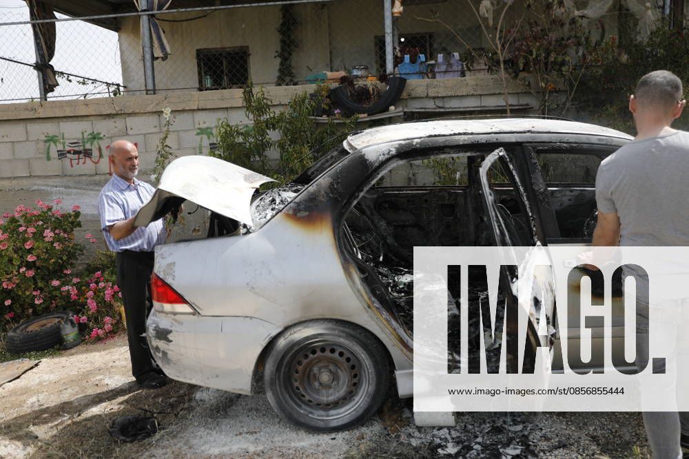 Palestinians inspect damage after settler attack near Hebron Palestinians inspect damage at the site of an attack carried out by Israeli settlers targeting Palestinian vehicles and property in the town of Surif northwest of Hebron in the occupied West Bank on May 17, 2026. Settlers set fire to a vehicle and spray-painted racist slogans at the scene, amid anger and condemnation among Palestinian residents over repeated attacks on their property. Photo by Mamoun Wazwaz apaimages Hebron West Bank Palestinian Territory 170526_Hebron_MW_00(17)