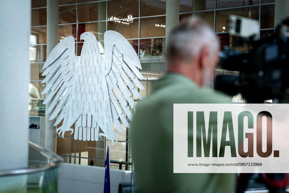 German Bundestag, 80 plenary session Symbol image eagle in the plenary hall with a cameraman at the 80 session of the German Bundestag in Berlin Berlin Berlin Germany