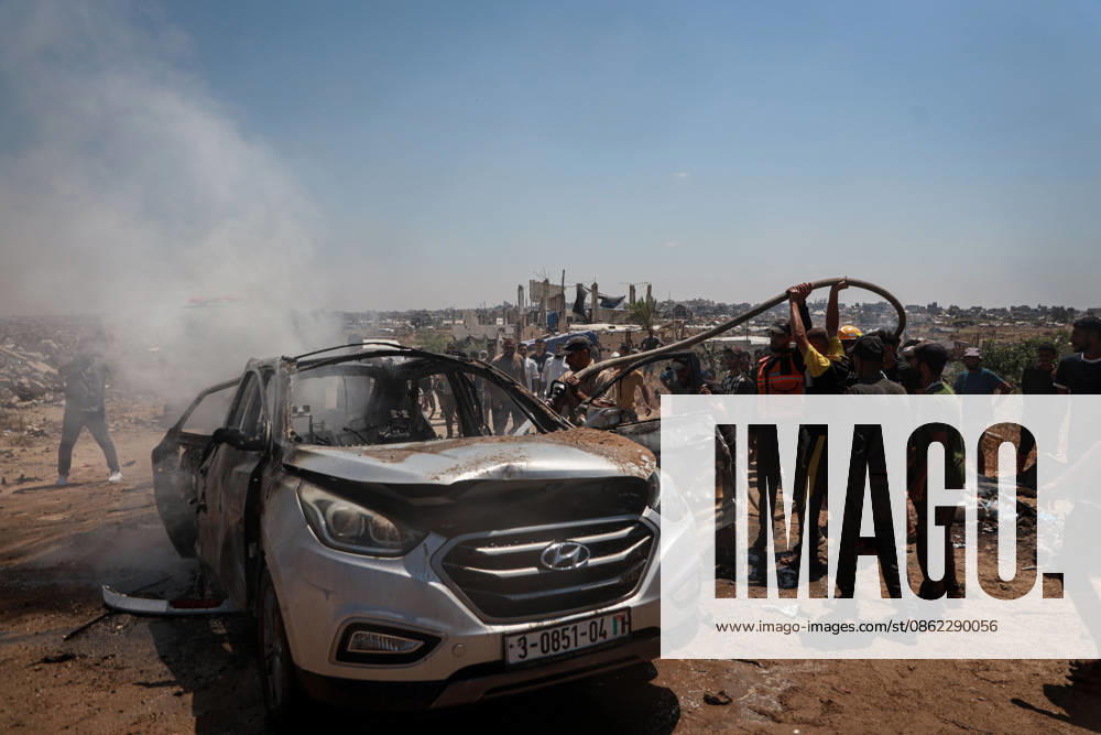Israeli attacks continue in Gaza GAZA, PALESTINE - JULY 21 : Firefighters and local Palestinians attempt to extinguish a burning civilian vehicle after it was targeted in an Israeli attack in the Nuseirat refugee camp in the central Gaza Strip on July 21, 2026 in Gaza, Palestine. Abdalhkem Abu Riash Anadolu Gaza City Gaza. Editorial use only. Please get in touch for any other usage.