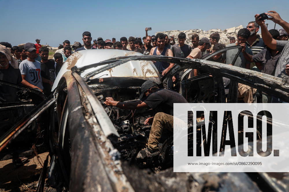 Israeli attacks continue in Gaza GAZA, PALESTINE - JULY 21 : Firefighters and local Palestinians attempt to extinguish a burning civilian vehicle after it was targeted in an Israeli attack in the Nuseirat refugee camp in the central Gaza Strip on July 21, 2026 in Gaza, Palestine. Abdalhkem Abu Riash Anadolu Gaza City Gaza. Editorial use only. Please get in touch for any other usage.