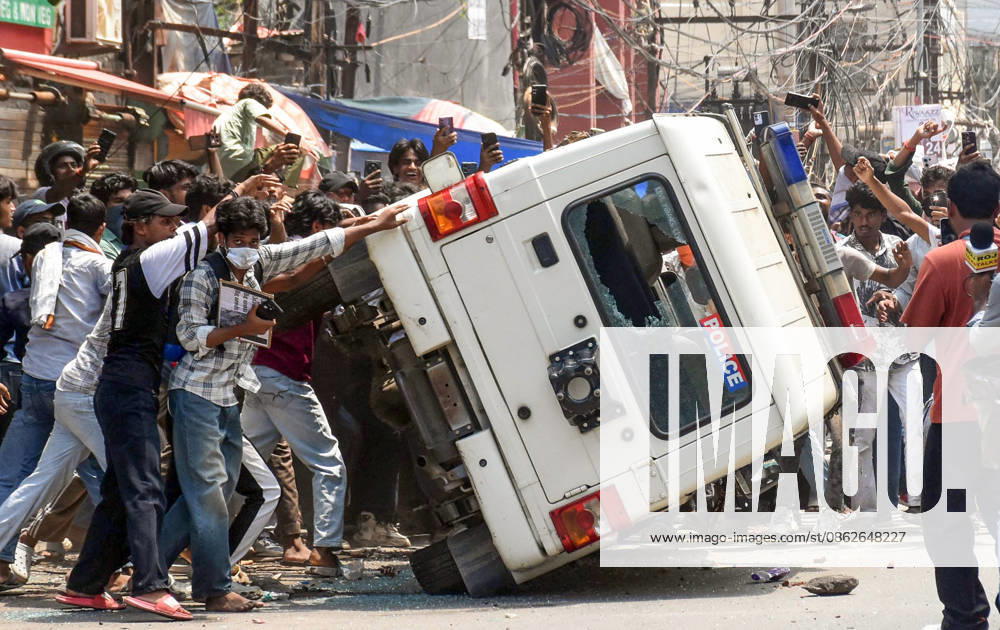 Clashes erupt between police and protesters erupt during the Bihar Bandh protest Patna, Jul 25 (ANI): Protesters damage a police vehicle during the Bihar Bandh protest against the alleged NEET paper leak, in Patna on Saturday. PATNA BIHAR INDIA