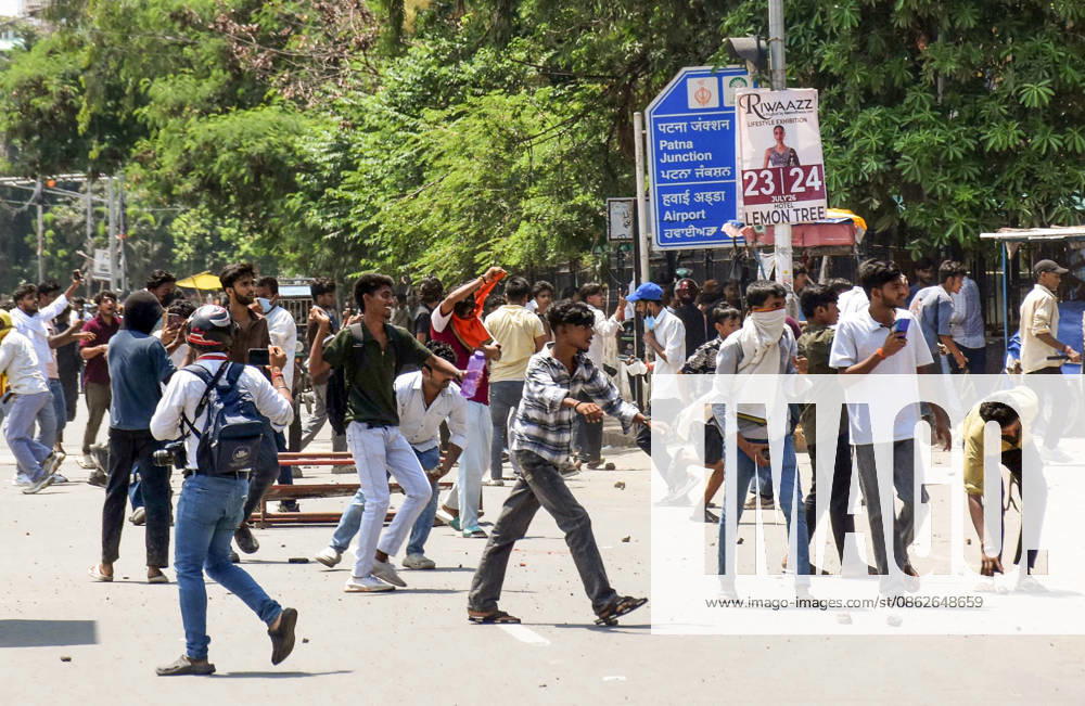 Clashes erupt between police and protesters erupt during the Bihar Bandh protest Patna, Jul 25 (ANI): Protesters pelt stones during the Bihar Bandh protest against the alleged NEET paper leak, in Patna on Saturday. PATNA BIHAR INDIA
