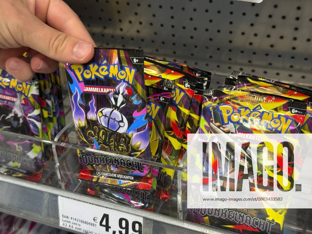 Germany, Bavaria, Pokémon trading cards on a shelf at a supermarket in Bavaria; a young teenage girl reaches for a pack August 5, 2026, Pokémon August 5, 2026, Pokémon