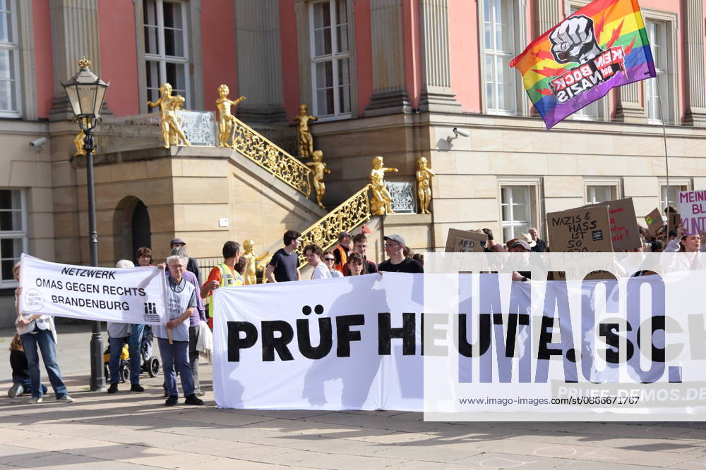 Protesters carrying a banner reading Review Today, Schütz Tomorrow march around the state parliament during a demonstration calling for the Federal Constitutional Court to review far-right parties, Alter Markt, Potsdam, September 12, 2026. Review demonstration in Potsdam