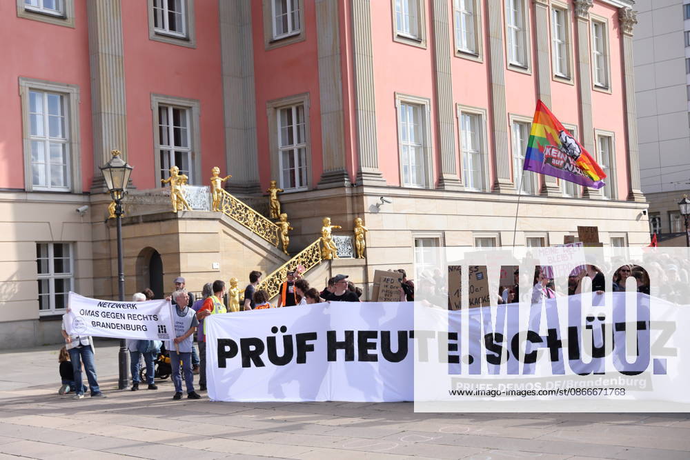 Protesters carrying a banner reading Review Today, Schütz Tomorrow march around the state parliament during a demonstration calling for the Federal Constitutional Court to review far-right parties, Alter Markt, Potsdam, September 12, 2026. Review demonstration in Potsdam