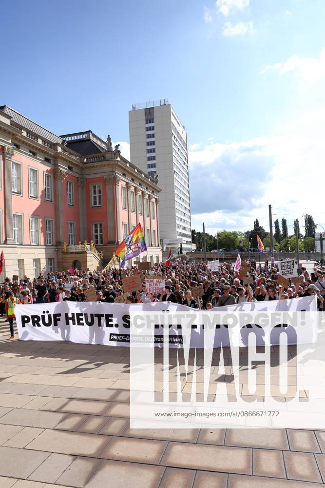Protesters carrying a banner reading Review today, Schütz tomorrow march around the state parliament during a demonstration calling for the Federal Constitutional Court to review far-right parties, Alter Markt, Potsdam, September 12, 2026. Review demonstration in Potsdam