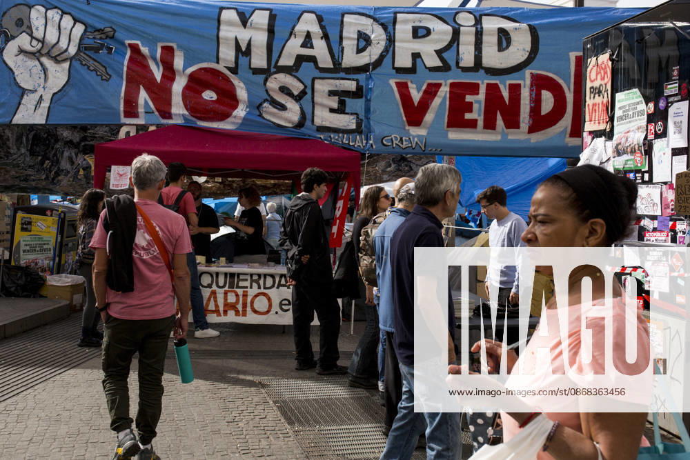 People approach information points at one of the entrances to the protest camp in Madrid s central Puerta del Sol, during a protest camp against the high cost of housing and rent in Spain. The protest arose following the eviction of an 87-year-old woman from her apartment in Madrid. Madrid Spain - ZUMAs296 20261001_znp_s296_009