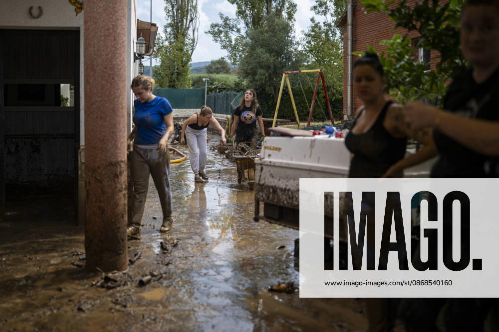 Heavy rains in Catalonia leave two dead and the Besòs River at risk of flooding. Residents clean up the mud that has accumulated in the streets and homes due to the torrential rains, on October 4, 2026, in Montornès del Vallès, Barcelona, Catalonia, Spain. The storm hitting Catalonia has left two people dead in the region. The president of the Generalitat, Salvador Illa, reported the death in Tordera of a 75-year-old man, who was at a campground when a wall reportedly collapsed on him. The second victim is a person who had been reported missing and was found in Montornès del Vallès. Emergency services are searching for another missing person in Riera de Pineda de Mar. The rains and storms have put eleven autonomous communities on alert thi