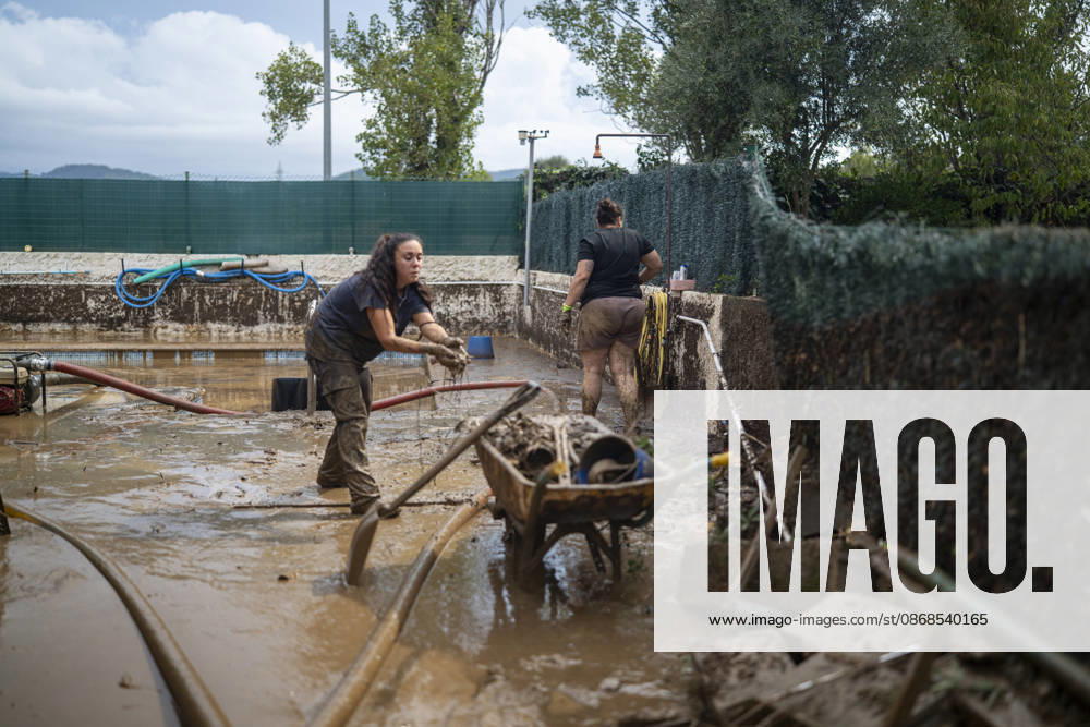 Heavy rains in Catalonia leave two dead and the Besòs River at risk of flooding. Residents clean up the mud that has accumulated in the streets and homes due to the torrential rains, on October 4, 2026, in Montornès del Vallès, Barcelona, Catalonia, Spain. The storm hitting Catalonia has left two people dead in the region. The president of the Generalitat, Salvador Illa, reported the death in Tordera of a 75-year-old man, who was at a campground when a wall reportedly collapsed on him. The second victim is a person who had been reported missing and was found in Montornès del Vallès. Emergency services are searching for another missing person in Riera de Pineda de Mar. The rains and storms have put eleven autonomous communities on alert thi
