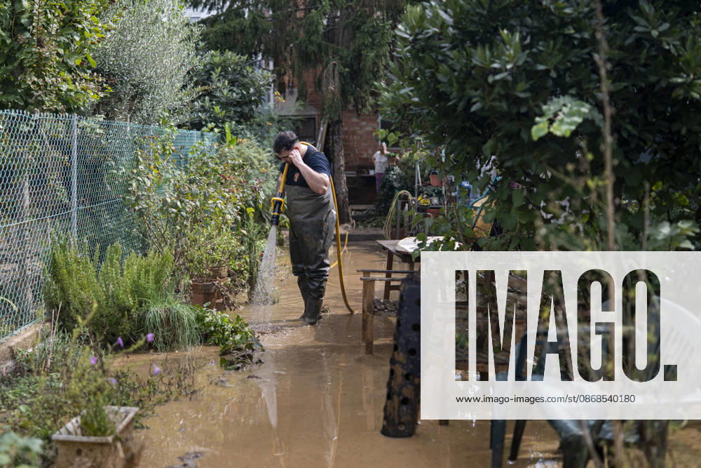 Heavy rains in Catalonia leave two dead and the Besòs River at risk of flooding. Residents clean up the mud that has accumulated in the streets and homes due to the torrential rains, on October 4, 2026, in Montornès del Vallès, Barcelona, Catalonia, Spain. The storm hitting Catalonia has left two people dead in the region. The president of the Generalitat, Salvador Illa, reported the death in Tordera of a 75-year-old man, who was at a campground when a wall reportedly collapsed on him. The second victim is a person who had been reported missing and was found in Montornès del Vallès. Emergency services are searching for another missing person in Riera de Pineda de Mar. The rains and storms have put eleven autonomous communities on alert thi