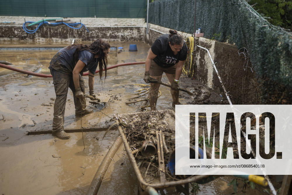 Heavy rains in Catalonia leave two dead and the Besòs River at risk of flooding. Residents clean up the mud that has accumulated in the streets and homes due to the torrential rains, on October 4, 2026, in Montornès del Vallès, Barcelona, Catalonia, Spain. The storm hitting Catalonia has left two people dead in the region. The president of the Generalitat, Salvador Illa, reported the death in Tordera of a 75-year-old man, who was at a campground when a wall reportedly collapsed on him. The second victim is a person who had been reported missing and was found in Montornès del Vallès. Emergency services are searching for another missing person in Riera de Pineda de Mar. The rains and storms have put eleven autonomous communities on alert thi