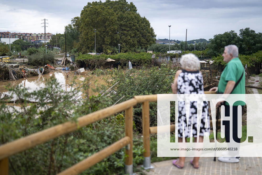 Heavy rains in Catalonia leave two dead and the Besòs River at risk of flooding Two people look at the mud and standing water caused by the torrential rains on October 4, 2026, in Montornès del Vallès, Barcelona, Catalonia, Spain. The storm hitting Catalonia has left two people dead in the region. The president of the Generalitat, Salvador Illa, reported the death in Tordera of a 75-year-old man, who was at a campground when a wall reportedly collapsed on him. The second victim is a person who had been reported missing and was found in Montornès del Vallès. Emergency services are searching for another missing person in Riera de Pineda de Mar. The rains and storms have put eleven autonomous communities on alert this Sunday in Spain, includi