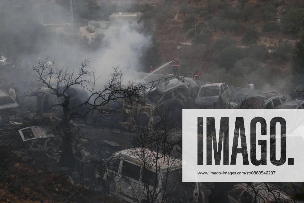 Israeli Settlers Set Fire To Olive Trees And Car Scrap Yard Near Silwad SILWAD, WEST BANK, PALESTINE OCTOBER 4, 2026: Israeli settlers set fire to olive trees and a car scrap yard between the villages of Ein Yabrud and Silwad, according to the information provided. The owner of the repair shop said more than 50 cars were destroyed in the fire. The incident occurred amid ongoing attacks targeting Palestinian property and agricultural land in the area. Fires affecting olive trees and other Palestinian property have also been reported in areas around Silwad. Ramallah Palestine, State of