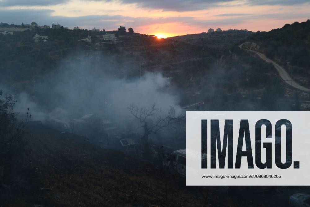 Israeli Settlers Set Fire To Olive Trees And Car Scrap Yard Near Silwad SILWAD, WEST BANK, PALESTINE OCTOBER 4, 2026: Israeli settlers set fire to olive trees and a car scrap yard between the villages of Ein Yabrud and Silwad, according to the information provided. The owner of the repair shop said more than 50 cars were destroyed in the fire. The incident occurred amid ongoing attacks targeting Palestinian property and agricultural land in the area. Fires affecting olive trees and other Palestinian property have also been reported in areas around Silwad. Ramallah Palestine, State of