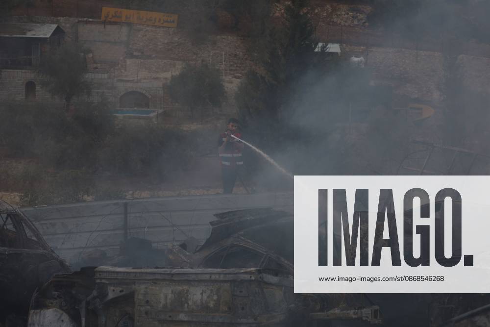 Israeli Settlers Set Fire To Olive Trees And Car Scrap Yard Near Silwad SILWAD, WEST BANK, PALESTINE OCTOBER 4, 2026: Israeli settlers set fire to olive trees and a car scrap yard between the villages of Ein Yabrud and Silwad, according to the information provided. The owner of the repair shop said more than 50 cars were destroyed in the fire. The incident occurred amid ongoing attacks targeting Palestinian property and agricultural land in the area. Fires affecting olive trees and other Palestinian property have also been reported in areas around Silwad. Ramallah Palestine, State of