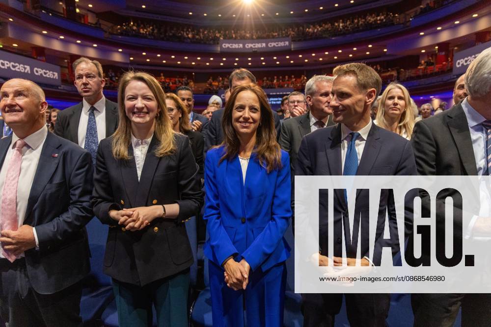 Shadow Secretary of State for Work and Pensions, Helen Whately (center), and Shadow Home Secretary, Chris Philp (to her right) standing in the audience on day one of the British Conservative Party annual conference at the International Convention Centre (ICC) in Birmingham.The British Conservative Party holds itÃ¢â‚¬â ¢s annual conference at the International Convention Centre (ICC) in Birmingham Birmingham United Kingdom - ZUMAs197 20261004_aaa_s197_160