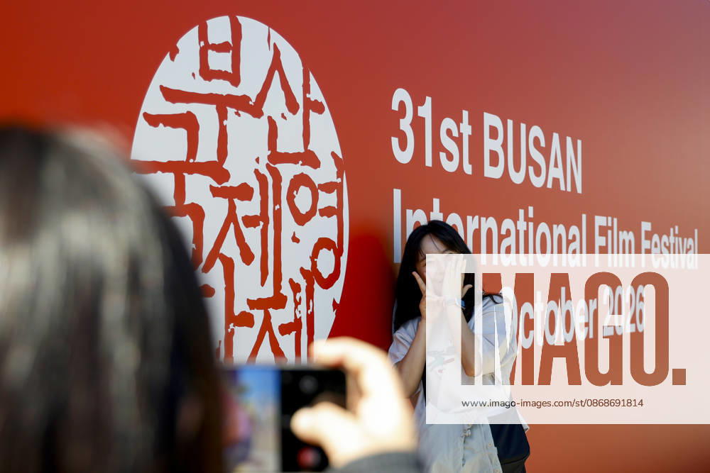 People visit the Busan International Film Festival, South Korea People pose for photographs near the Busan Cinema Center, the main venue of the 31st Busan International Film Festival (BIFF), in Busan, South Korea, on October 06, 2026. Busan South Korea
