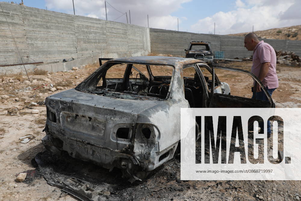 Palestinian Inspects Burned Vehicles Near al-Samu South of Hebron A Palestinian man inspects his burned vehicles near the town of al-Samu, south of Hebron, in the West Bank, on October 6, 2026, after an apparent arson attack believed to have been carried out by Israeli settlers. The incident comes amid an increase in settler attacks on Palestinians and their property in different areas of the West Bank. Photo by Mamoun Wazwaz apaimages Hebron West Bank Palestinian Territory 061026_Hebron_MW_00(2)