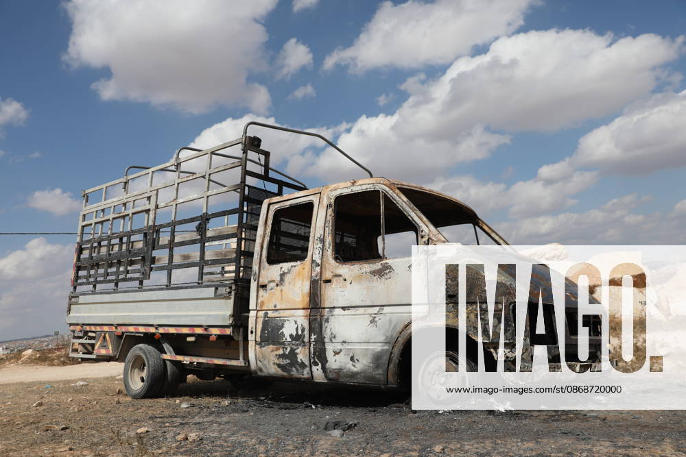 Palestinian Inspects Burned Vehicles Near al-Samu South of Hebron A Palestinian man inspects his burned vehicles near the town of al-Samu, south of Hebron, in the West Bank, on October 6, 2026, after an apparent arson attack believed to have been carried out by Israeli settlers. The incident comes amid an increase in settler attacks on Palestinians and their property in different areas of the West Bank. Photo by Mamoun Wazwaz apaimages Hebron West Bank Palestinian Territory 061026_Hebron_MW_00(20)