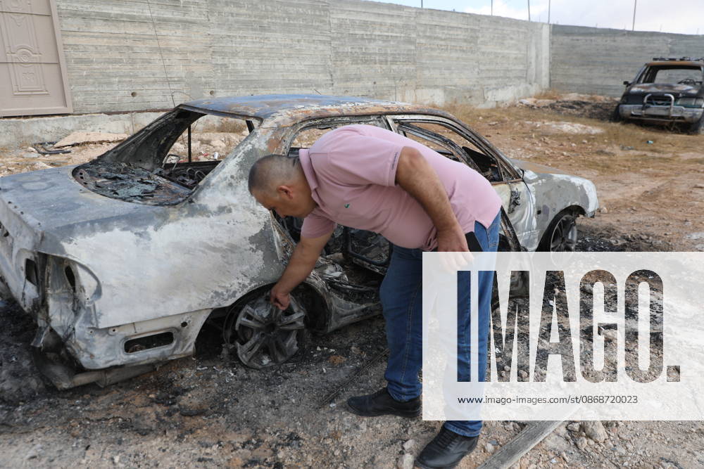 Palestinian Inspects Burned Vehicles Near al-Samu South of Hebron A Palestinian man inspects his burned vehicles near the town of al-Samu, south of Hebron, in the West Bank, on October 6, 2026, after an apparent arson attack believed to have been carried out by Israeli settlers. The incident comes amid an increase in settler attacks on Palestinians and their property in different areas of the West Bank. Photo by Mamoun Wazwaz apaimages Hebron West Bank Palestinian Territory 061026_Hebron_MW_00(18)