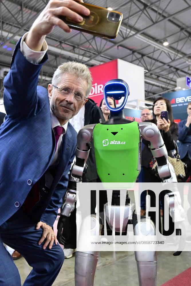 Czech Senate President Milos Vystrcil takes a selfie with a humanoid robot at opening of the 67th International Engineering Fair, which begins at Vystaviste 1 exhibition grounds in Brno, Czech Republic, on October 6th, 2026. International Fair of Machine Tools and Forming Machines IMT, International Welding Engineering Fair Welding, International Fair of Plastics, Rubber and Composites Plastex, International Fair of Surface Treatment Technologies Profintech and International Foundry Fair Fond-Ex also start. (CTKxPhoto VaclavxSalek) CTKPhotoP2026100605271 CTKPhotoP2026100605271