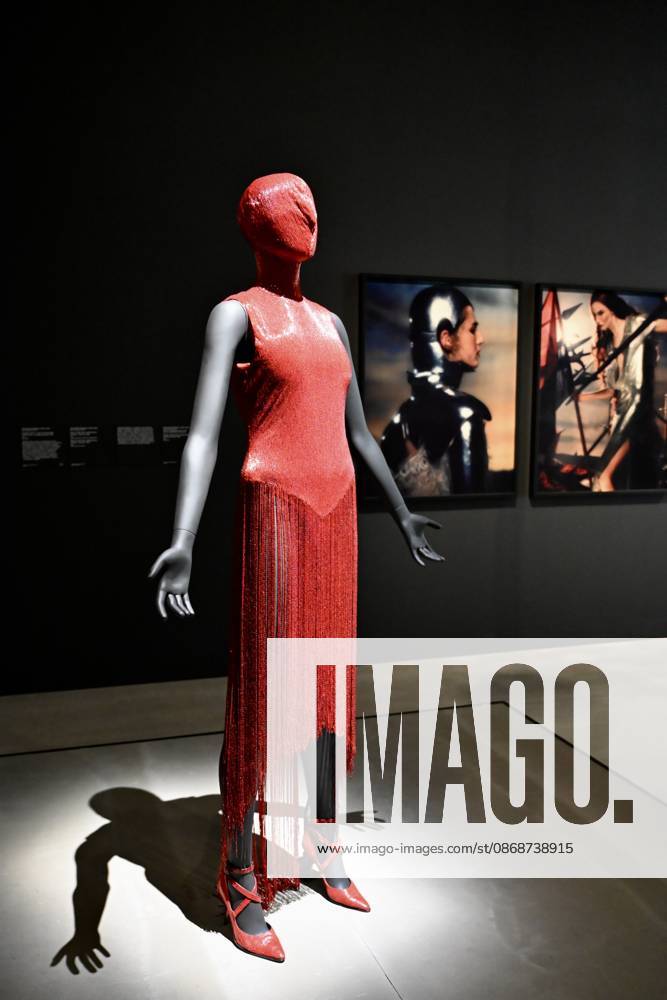 Tate Britain, The 90s : Art and Fashion London, UK. Red Dress by Alexander McQueen. Art & Fashion, Tate Britain. Tate Britain has opened the first exhibition to explore the art, photography and fashion of the 1990s, adecade synonymous with possibility, optimism and an audacious spirit. The 90s : Art and Fashion explores this period s surge of creative energy, shaped by its opportunities and challenges. 06 October 2026., Credit:Michael Melia Michael Melia - B2778 Avalon
