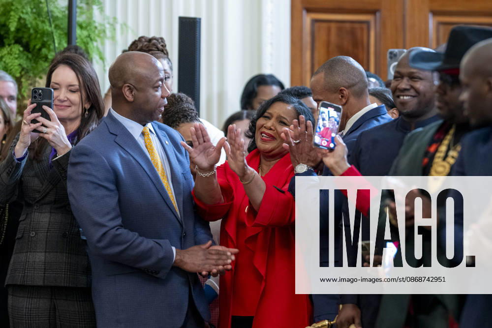 U.S Senator Tim Scott, R-SC, center, applauds criminal rights advocate Alice Johnson, right, as Secretary of Agriculture Brooke Rollins, left, looks on during a Black History Month event at the East Room of the White House, February 20, 2025 in Washington, D.C. Washington United States - ZUMAp138 20261006_zaa_p138_007