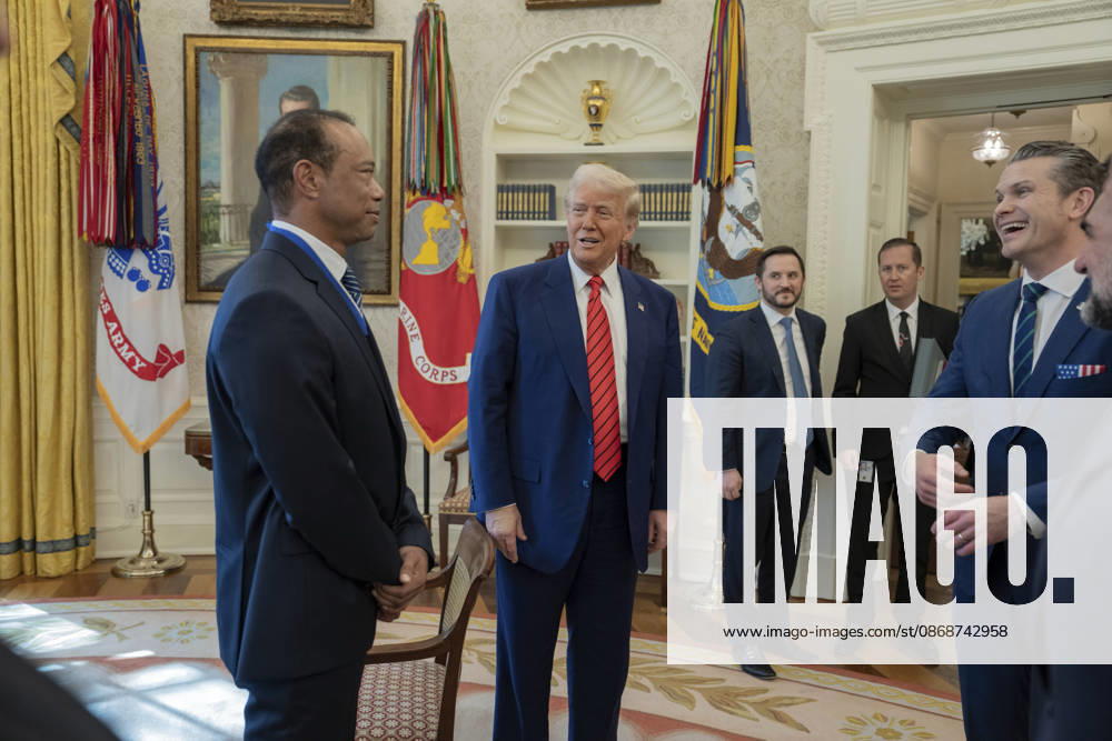 U.S. President Donald Trump speaks with golfer Tiger Woods and officials in the Oval Office of the White House, February 20, 2025 in Washington, D.C. Woods, who received the Presidential Medal of Freedom from Trump in 2019, joined PGA Tour leaders at the White House for talks on a proposed deal with Saudi Arabiaâ€⠢s Public Investment Fund before Trump introduced him as a surprise guest at a Black History Month reception. Washington United States of America - ZUMAp138 20261006_zaa_p138_009