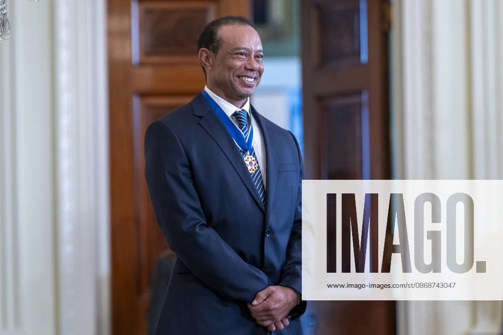 Golfer Tiger Woods smiles as he is introduced by U.S. President Donald Trump at a reception honoring Black History Month in the East Room of the White House, February 20, 2025 in Washington, D.C. Trump introduced golfer Tiger Woods as a surprise guest at the reception in the East Room, where he praised Woods as one of the greatest athletes of all time. Washington United States of America - ZUMAp138 20261006_zaa_p138_014