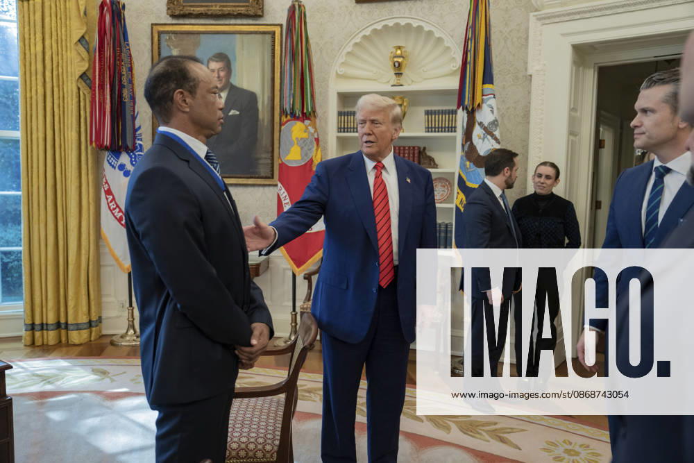 U.S. President Donald Trump speaks with golfer Tiger Woods and officials in the Oval Office of the White House, February 20, 2025 in Washington, D.C. Woods, who received the Presidential Medal of Freedom from Trump in 2019, joined PGA Tour leaders at the White House for talks on a proposed deal with Saudi ArabiaÃ¢â‚¬â ¢s Public Investment Fund before Trump introduced him as a surprise guest at a Black History Month reception. Washington United States of America - ZUMAp138 20261006_zaa_p138_015