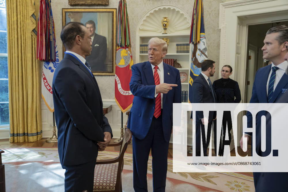 U.S. President Donald Trump speaks with golfer Tiger Woods and officials in the Oval Office of the White House, February 20, 2025 in Washington, D.C. Woods, who received the Presidential Medal of Freedom from Trump in 2019, joined PGA Tour leaders at the White House for talks on a proposed deal with Saudi ArabiaÃ¢â‚¬â ¢s Public Investment Fund before Trump introduced him as a surprise guest at a Black History Month reception. Washington United States of America - ZUMAp138 20261006_zaa_p138_017