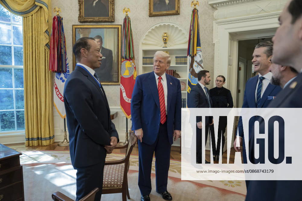 U.S. President Donald Trump speaks with golfer Tiger Woods and officials in the Oval Office of the White House, February 20, 2025 in Washington, D.C. Woods, who received the Presidential Medal of Freedom from Trump in 2019, joined PGA Tour leaders at the White House for talks on a proposed deal with Saudi Arabiaâ€⠢s Public Investment Fund before Trump introduced him as a surprise guest at a Black History Month reception. Washington United States of America - ZUMAp138 20261006_zaa_p138_016