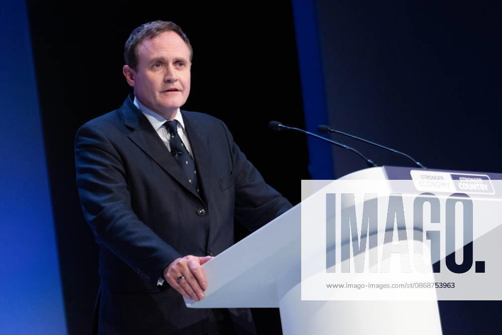 Tom Tugendhat MBE Shadow Foreign Secretary addresses audience. The session Defending Britain in a More Dangerous World took place on the main stage at the Conservative Party Conference at the ICC Birmingham. It featured key shadow cabinet figures including Tom Tugendhat, Helen Whately , James Cartlidge, and Alex Burghart , as well as a performance by St Mary s Ukrainian School choir. They were also joined by Yehor Cherniev, Ukrainian MP and Professor Niall Ferguson Birmingham United Kingdom - ZUMAs197 20261006_aaa_s197_109